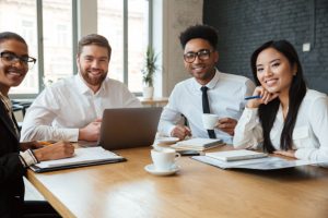 cheerful-young-colleagues-indoors-coworking_171337-742
